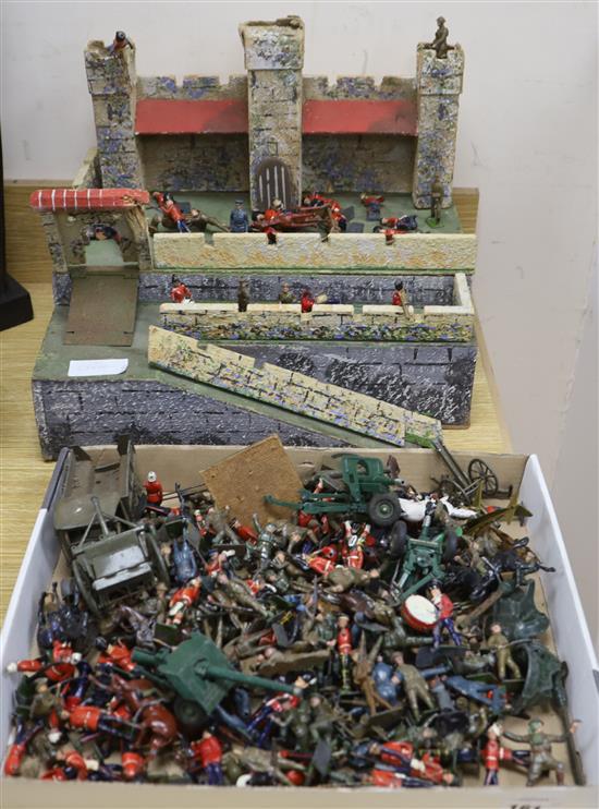 A quantity of Britains and other diecast military figures with fort.